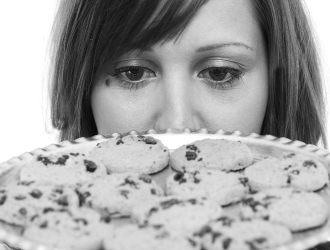 Staring woman at cookies.